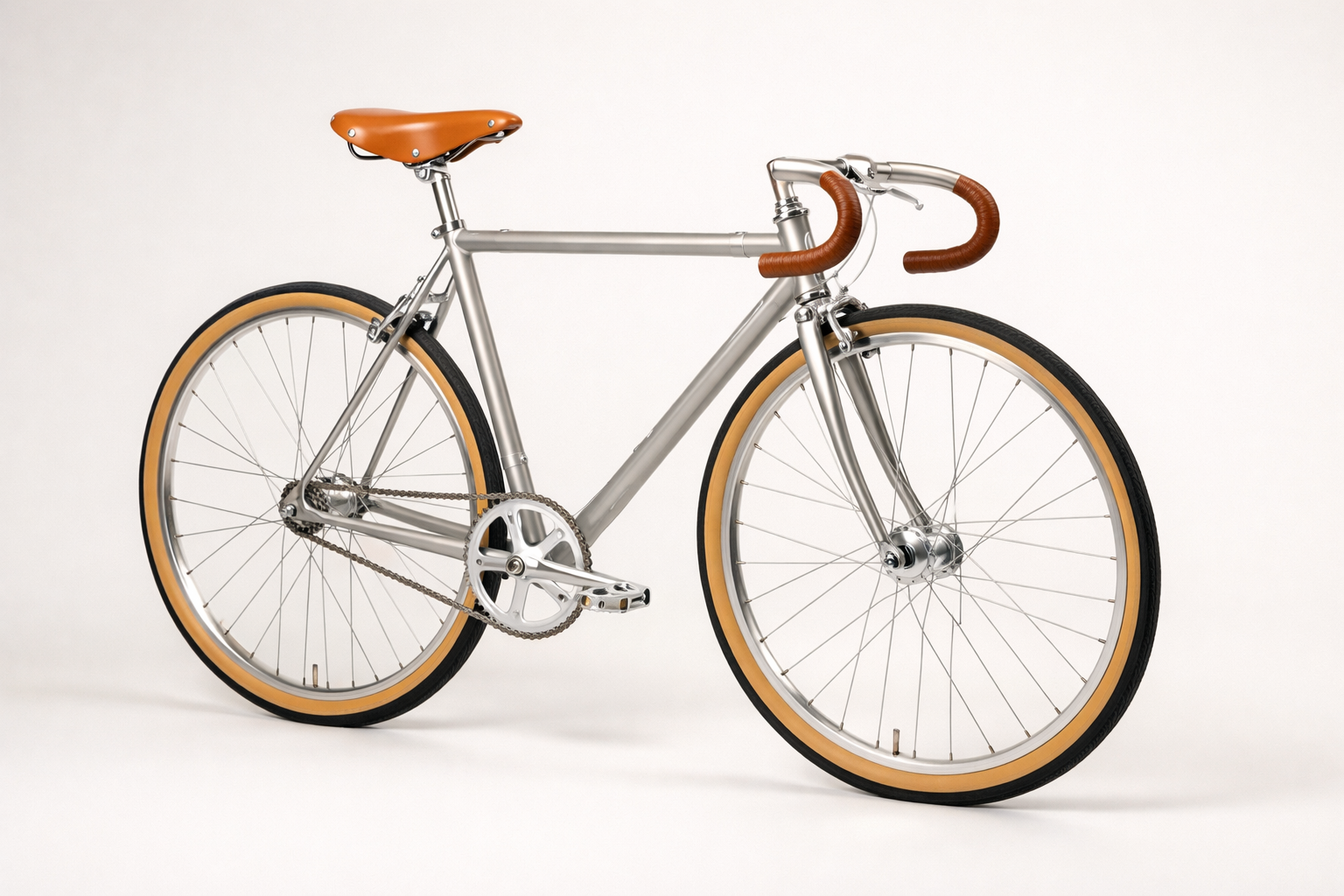 Omera city fixie bicycle, polished silver components on white background, three-quarter drive-side studio shot